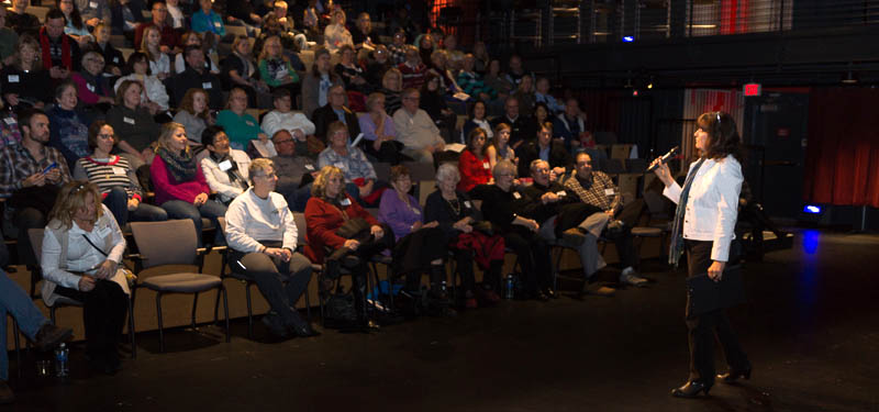 Jamie Huss presenting to theatre